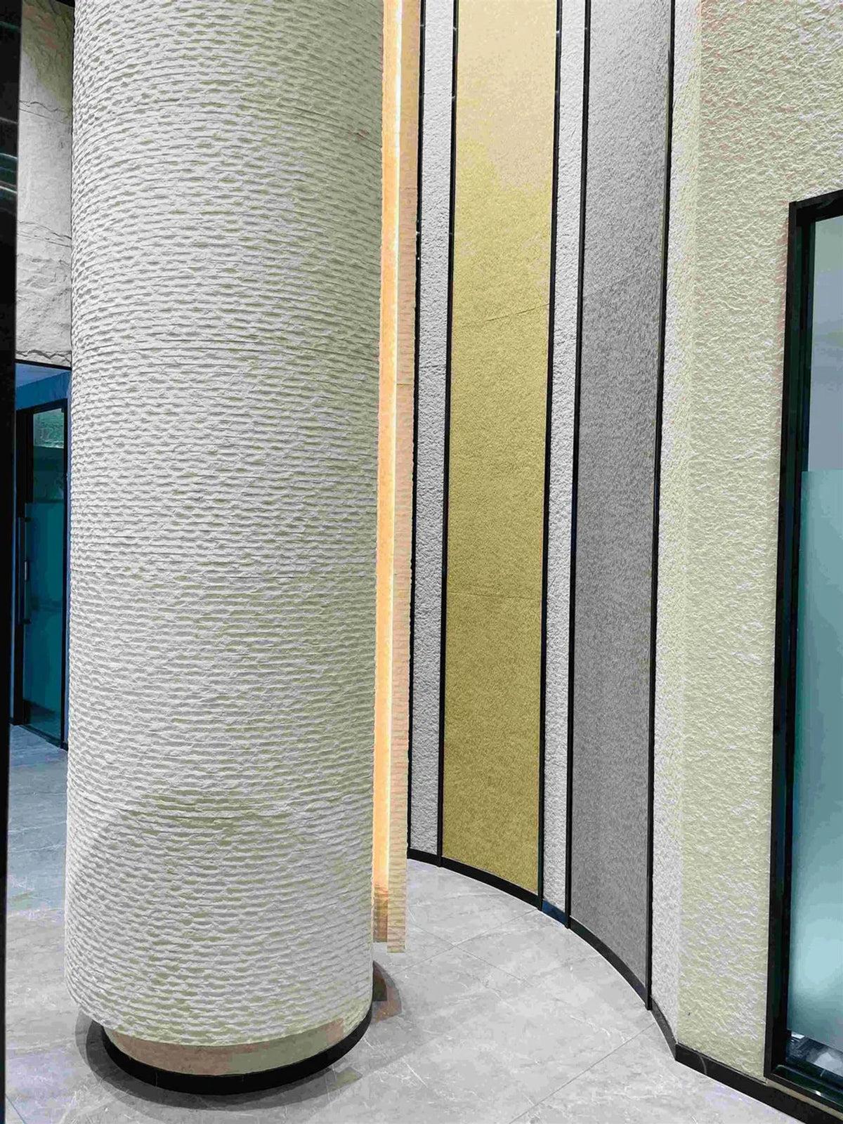 Flexible Natural Stone panels applied seamlessly to a curved column and adjoining vertical feature walls, showcasing textured