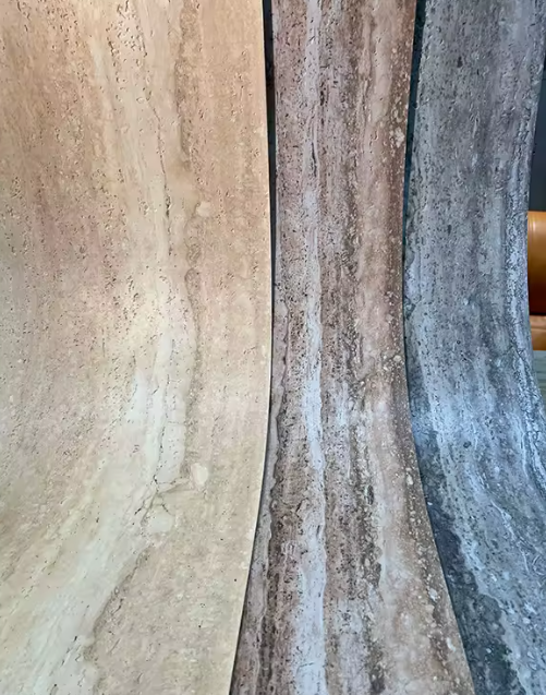 Three different colored FLEXIBLE STONE PANELS arranged side by side.