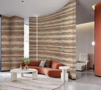Modern living room with a brown sofa, white coffee table, and FLEXIBLE STONE WALL. 