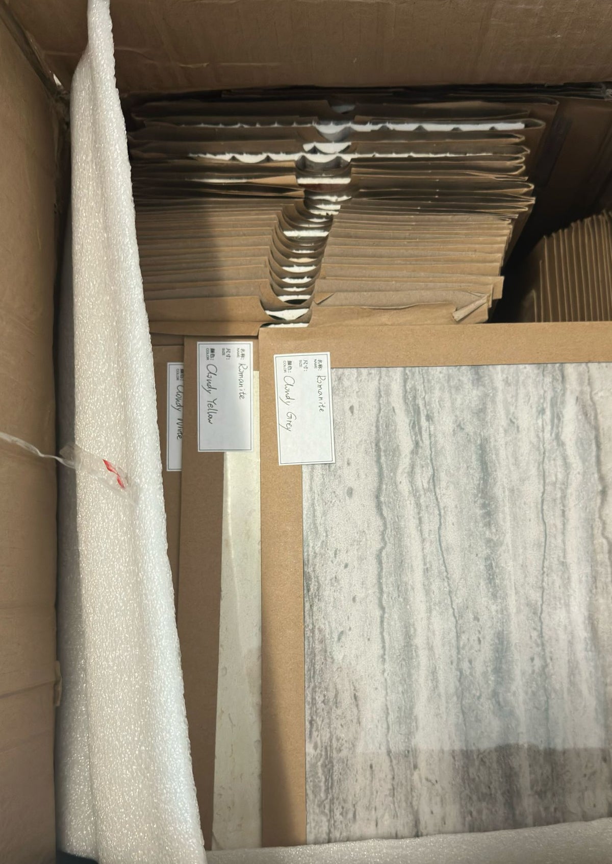 Flexible Stone sample panels showing varied surface textures and colours for material review